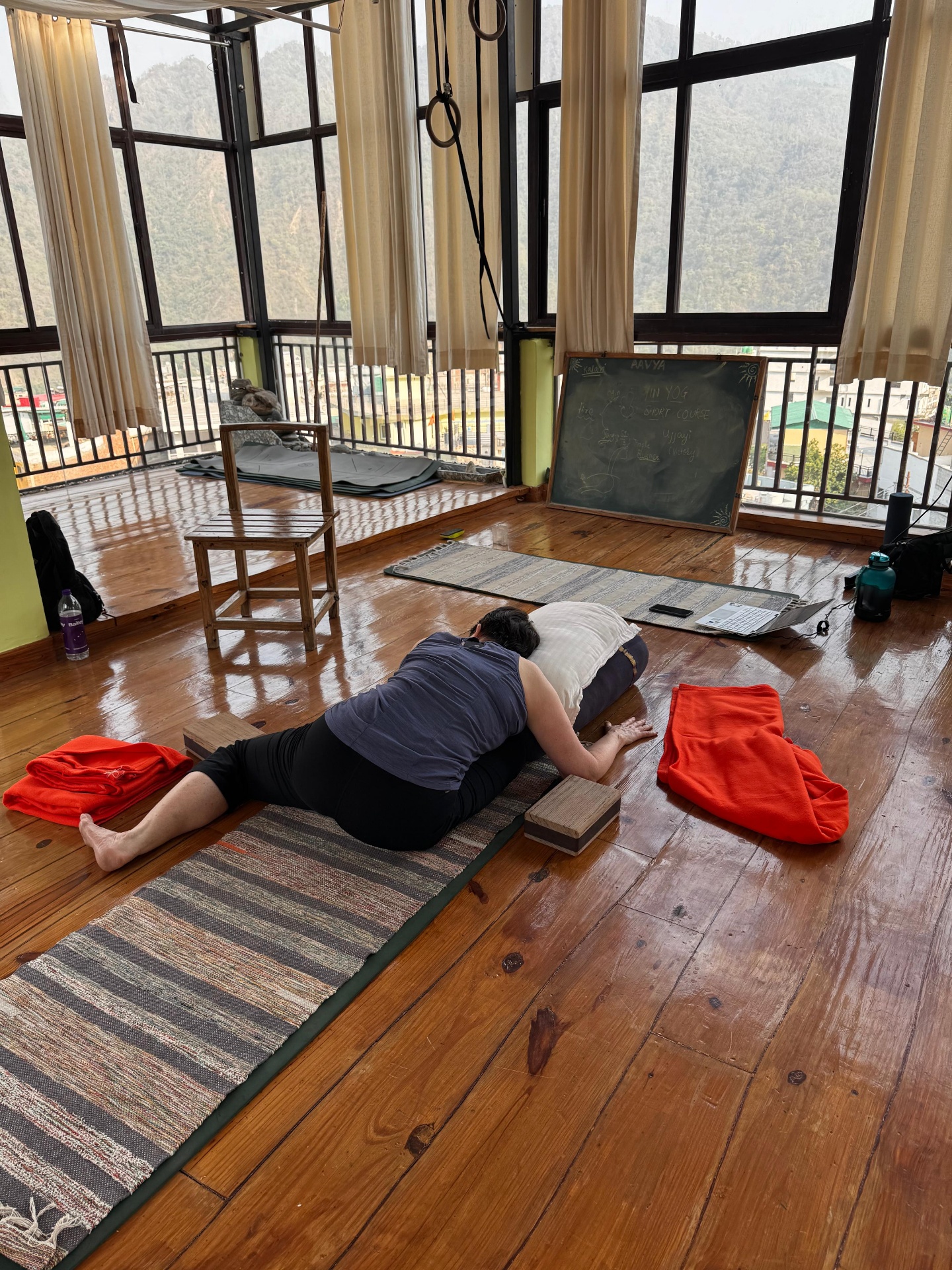 Supported Yin pose with bolsters and props